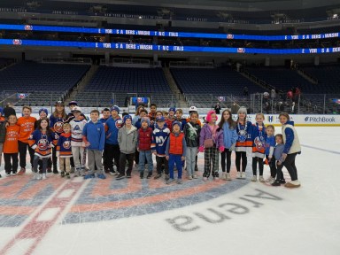 Rushmore students on the ice after the game.