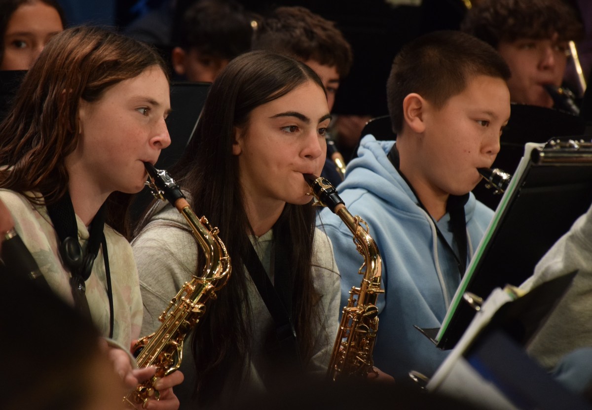 Middle school saxophone players Grace Feyrer, Sophie Naglieri and Matthew Provinsal (L. to R.) took advantage of the chance to learn from their high school peers.