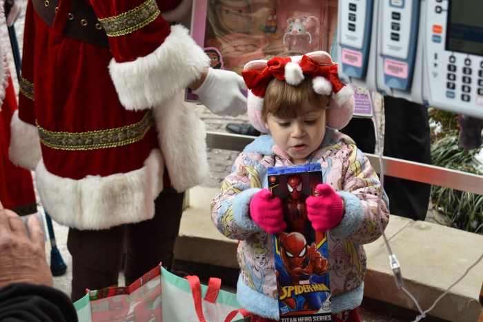 A young patient, 3, offered a Spiderman toy to her younger brother. 