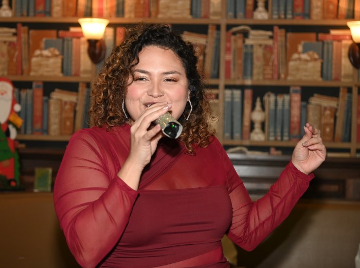 image 13 singer cee cee singing at the kids need more holiday cheer bus after party