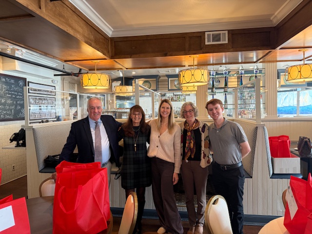 St. Peter Alcantara volunteers with the owner of Finn MacCool's.