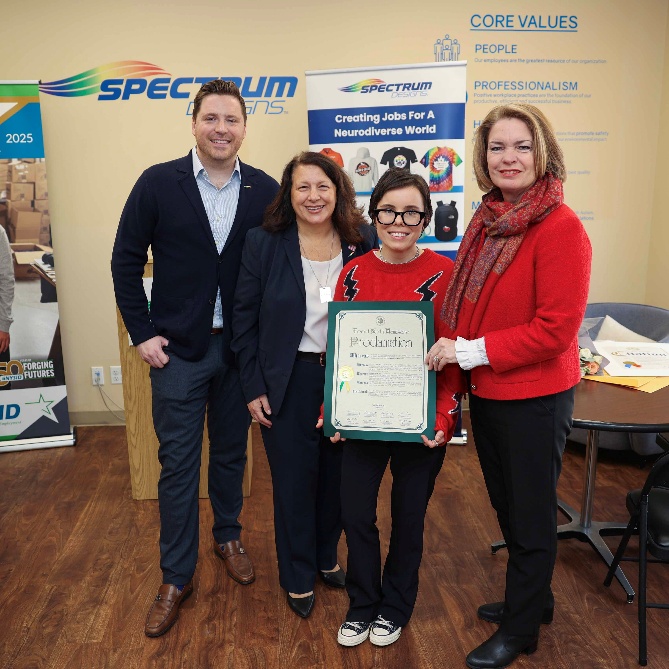 Patrick Bardsley, Mariann Dalimonte and Jennifer DeSena honoring Kelli Fisher at Spectrum Designs.