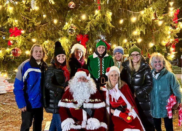 Board members of the Port Washington Christmas Celebration with Santa at the Port Washington Christmas tree lighting in Blumenfeld Family Park.