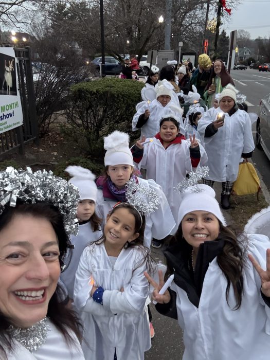 Port Washington children dressed up as angels to participate in the Nativity. 