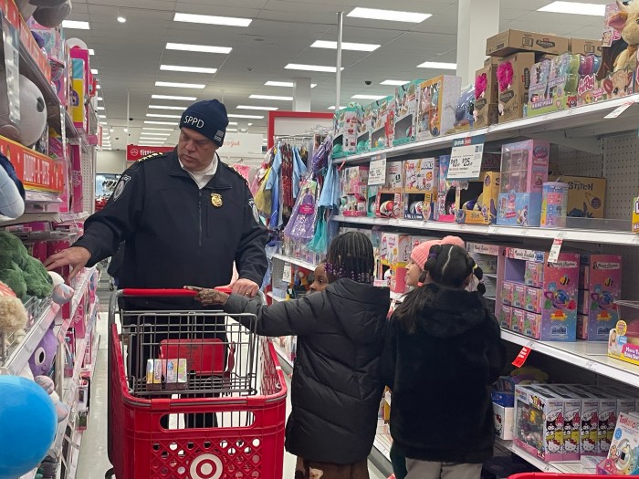Children were paired in twos with a police officer following to help keep track of the items.