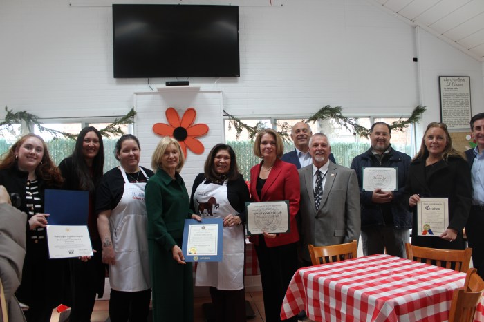 Elected officials and representatives joined the co-founders of The Nicholas Center Chocolate Lab to present them with proclamations.