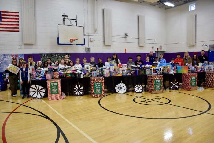 John Lewis Childs School’s Student Council, Advisers Marianna Antonakis andChristina Saunders, principal Kristina Lynch and assistant principal Meghan Dixon are pictured with Hance Family Foundation Founder/Co-President Warren J. Hance Jr. and Executive Director Tom Cannon on Dec. 19.