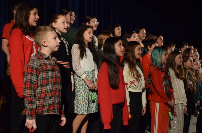Members of the fifth grade chorus entertained the crowd with a selection of holidaytunes.