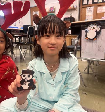 Fourth graders from Herricks’ Searingtown School show off the 3D creations that they designed and produced with help from students from Herricks High School.