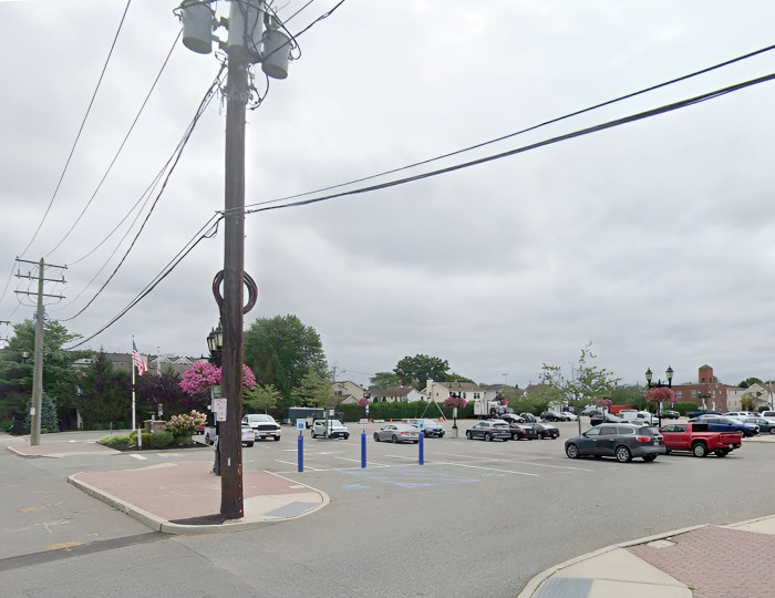 The parking lot where the theater is expected to be built in Farmingdale Village's downtown.