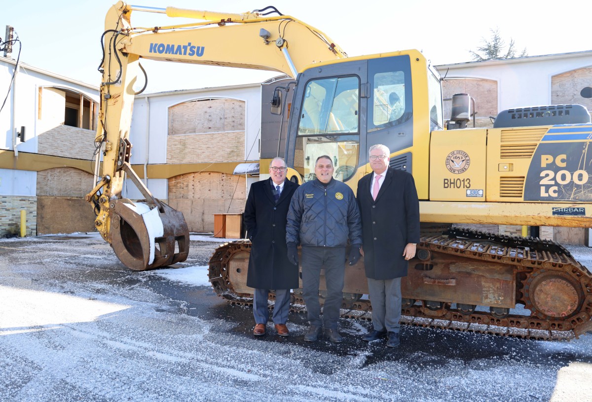 Oyster Bay Town Clerk Rich LaMarca, Town Supervisor Joseph Saladino and Town Council Member Andrew Monteleone (L. to R.) at the demolition of the Budget Inn.