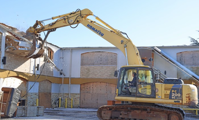 The razing of the Budget Inn in Massapequa has officially begun.