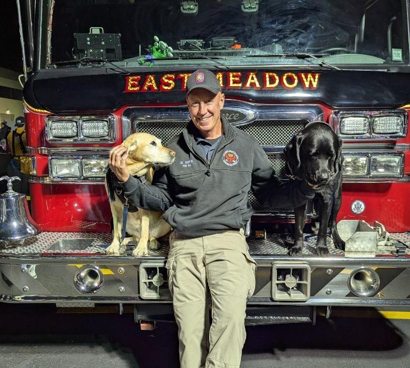 Nassau Fire Marshal's office investigators, K-9 Leah, Matt Kerin, and K-9 Chuck, (L. to R.).