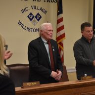 Mayor Paul Ehrbar (L.) addresses the public at a meeting for the Williston Park Board of Trustees.