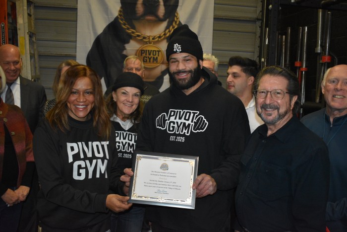 Pivot Gym owner Josh Jefferson with members of the Mineola Chamber of Commerce.