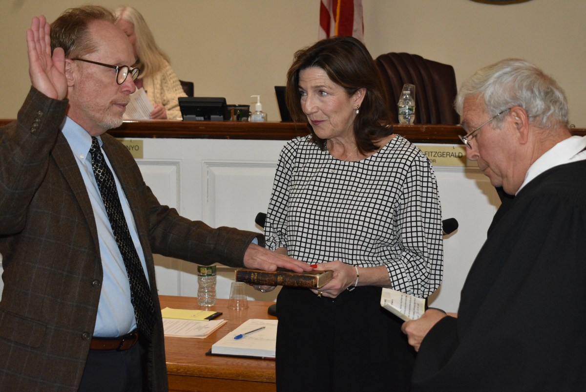 Perry Criscitelli (R.) swore in his successor, Keith Conway (L.), as Floral Park’s associate village justice.