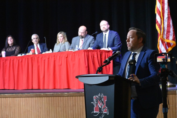Nathaniel Nichols, representative of Whiteman, Osterman & Hanna LLP, who carried out the investiagtion addressed the community in front of the Board of Edication and district administration.