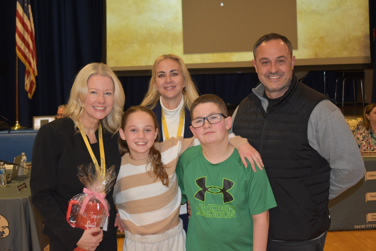 Manor Oaks principal Colleen Topping with her daughter, district Superintendent Jennifer Morrison-Raptis, her son, and her husband (L. to R.).