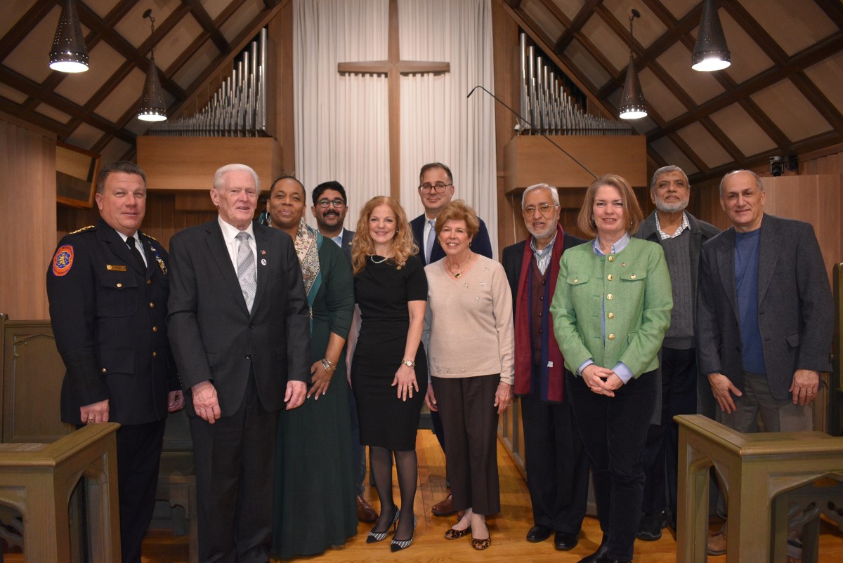 Faith leaders and municipal officials, such as Williston Park Mayor Paul Ehrbar (L.) and North Hempstead Town Supervisor Jennifer DeSena (R.) join East Williston Mayor Bonnie Parente (C.) at the service.