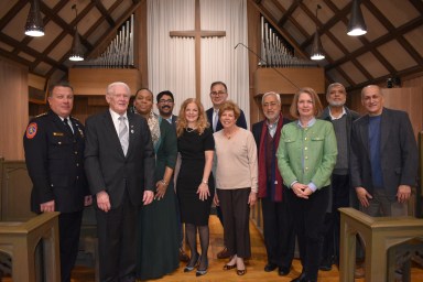 Faith leaders and municipal officials, such as Williston Park Mayor Paul Ehrbar (L.) and North Hempstead Town Supervisor Jennifer DeSena (R.) join East Williston Mayor Bonnie Parente (C.) at the service.