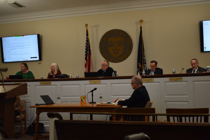 The Floral Park village board convened in front of a full audience to hear the applicant's formal response.