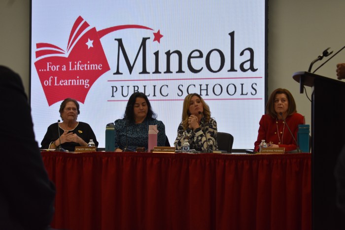 Acting superintendent Catherine Fishman (R.) addressed the community alongside members of the school board, Trustee Margaret Ballantyne-Mannion, Vice President Stacey DeCillis and President Cheryl Lampasona, (L. to R.).