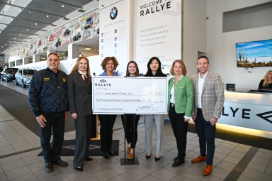 Rallye Motors donated $6,700 and a van full of food to Long Island Cares and People Loving People to help hungry families across Long Island.