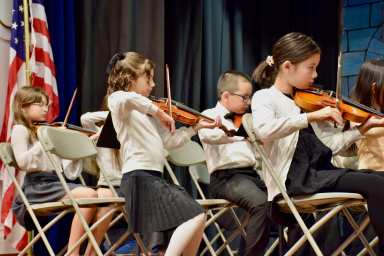 Floral Park-Bellerose School and John Lewis Childs School fourth grade cadet orchestra members performed at the recent board of education meeting.