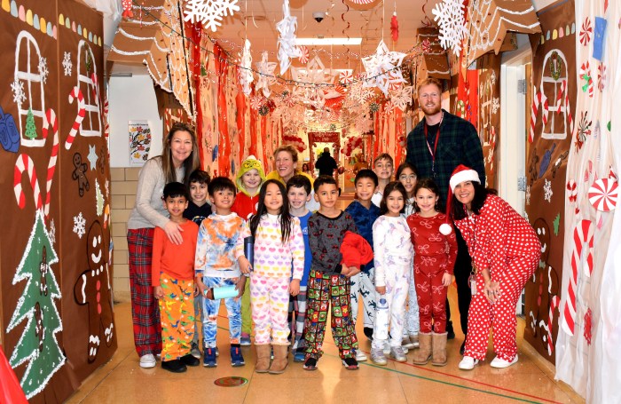 Students in 'Candy Cane Lane' with Glen Head principal Thomas Sheehan.