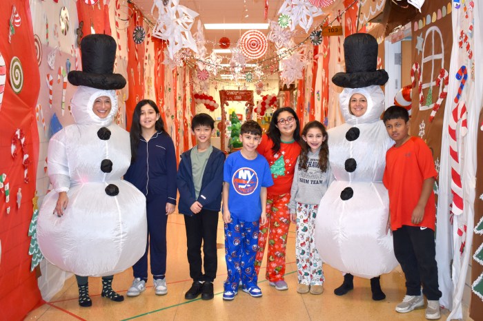 Students and faculty dress up for 'Candy Cane Lane' celebration in school.