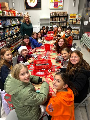 Glenwood Landing students decorating bags for food drive recipients.
