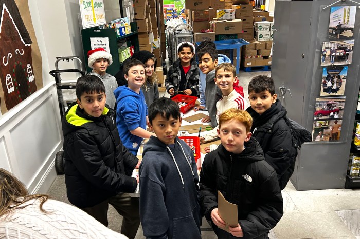 Glenwood Landing students preparing bags for a food drive. 