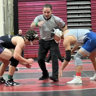 Students square off at a wrestling match that Herricks participated in.
