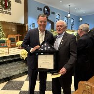 U.S. Rep. Tom Suozzi (L.) gave a flag to the Williston Park Village Mayor Paul Ehrbar (R.) for the village's 100th anniversary.
