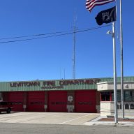 A Levittown Fire Department volunteer was one of two people killed in a car crash in Hicksville.