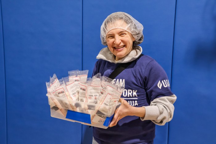More than 200 volunteers lined up at Sid Jacobson JCC to be a part of a global meal-packing effort on Martin Luther King Jr. Day.