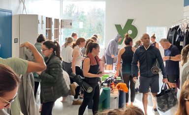 Yoga students preparing for class at YogaSix Manhasset
