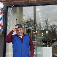 Owner of Alek's Barbershop Abraham Kalantarov outside his new shop