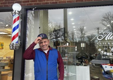 Owner of Alek's Barbershop Abraham Kalantarov outside his new shop