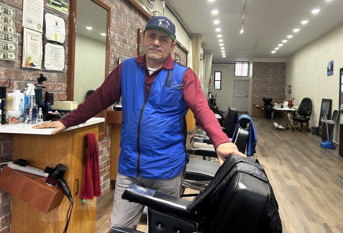 Owner Abraham Kalantarov inside Alek's Barbershop