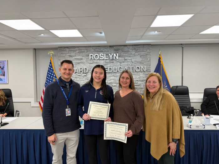 Athletic Director Michael Brostowski, Junior Carina Dai, Coach Meghan Harding and board of education president Meryl Waxman Ben-Levy honoring Dai and Harding (L. to R.).
