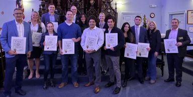 Ryan Schlotter (front row, third from left), president of the Oyster Bay–East Norwich Chamber of Commerce has worked hard for the communnity.