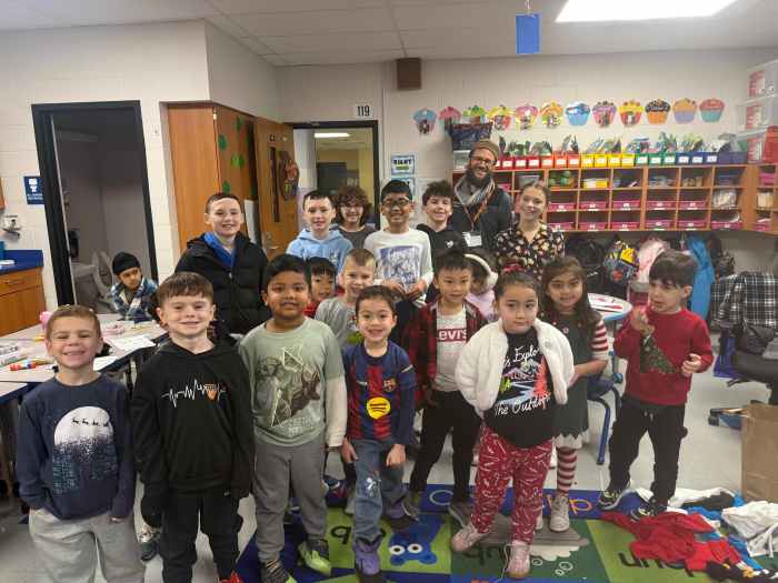 John Lewis Childs School kindergarten and sixth-grade students with Matthew Reid on the Day of Giving.