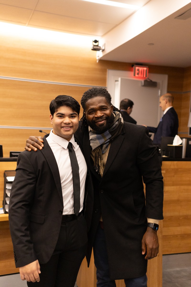 Dr. Martin Luther King Jr. Essay Writing Contest Aryan Mukherjee (L.) with the school security guard that he honored in his essay, Julius Opa (R.).