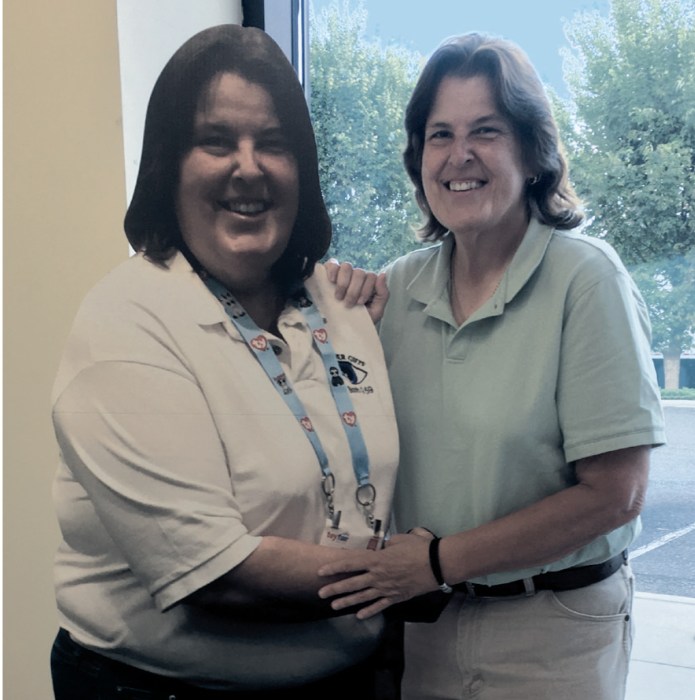 Author Mary Putre with a cardboard cutout of her younger self.
