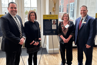 Mineola Middle School Dean of Students Steve Benner and Acting Superintendent Catherine Fishman, join Maryalice Leno, ASSET Bright Lights Award winner, and Mineola Director of Instructional Technology and Assessment Whittney Smith (L. to R.).