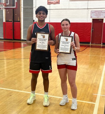 Mineola High School student-athletes Ryan Manu and Julianna Plunkett (L. to R.) were honored with Mineola Basketball Leadership Awards during the district’s annual Community Basketball Night.