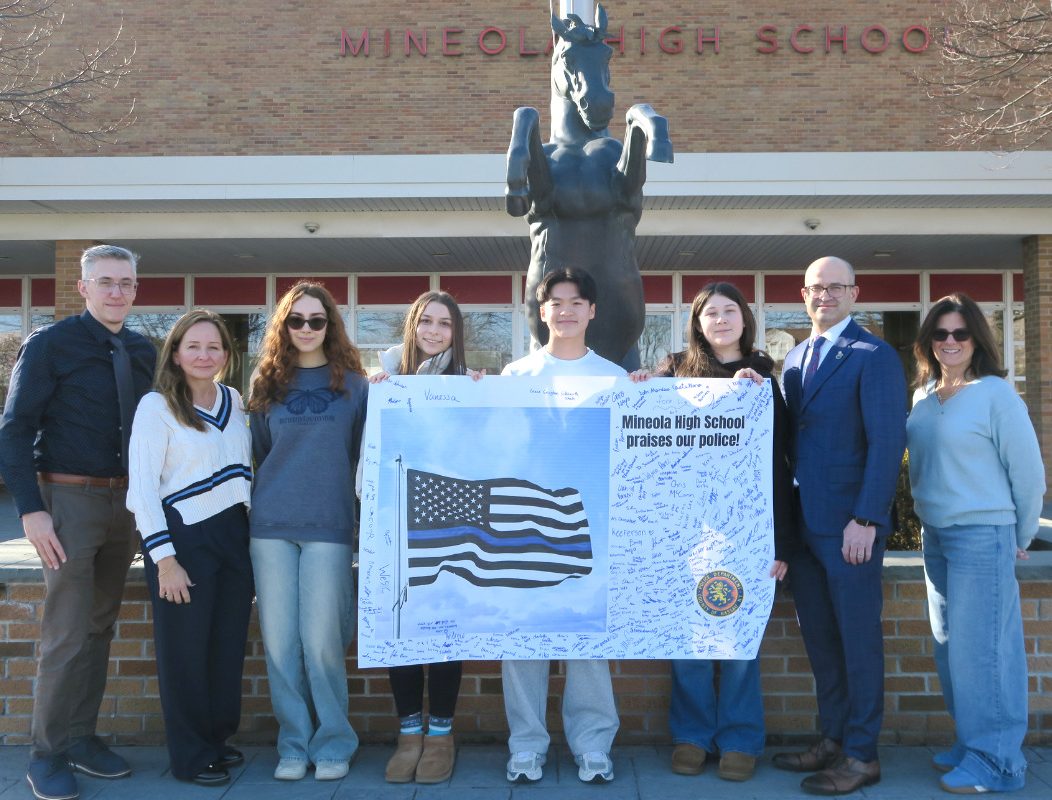 Members of the Mineola High School Student Service Center presented cards and posters created by learners throughout the district to Assembly Member Edward Ra (R-Franklin Square) for distribution to law enforcement.