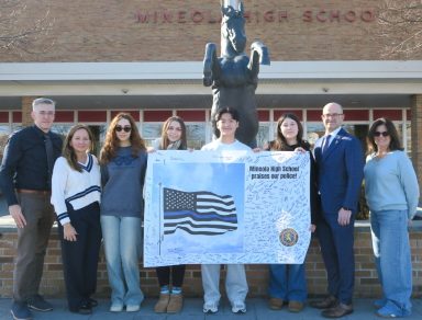 Members of the Mineola High School Student Service Center presented cards and posters created by learners throughout the district to Assembly Member Edward Ra (R-Franklin Square) for distribution to law enforcement.