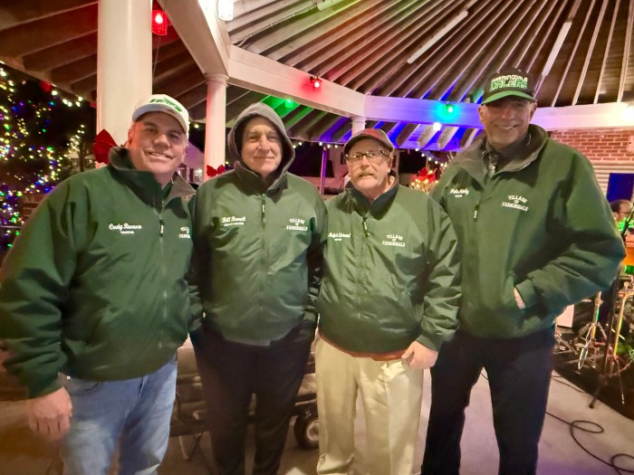 Farmingdale Village Board Member Craig Rosasco, Deputy Mayor Bill Russell, Mayor Ralph Ekstrand and Board Member Walter Priestley (L. to R.) at the holiday celebration.